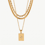 Set de collares dorados en capas, con dijes cuadrados y estrella en colgante