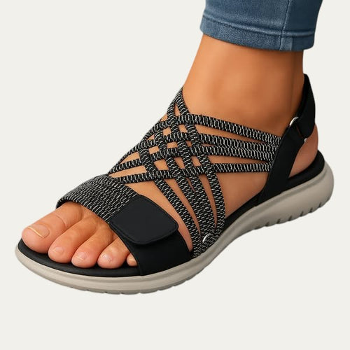 Sandalias ortopédicas negras con tiras elásticas y plataforma de suela gris