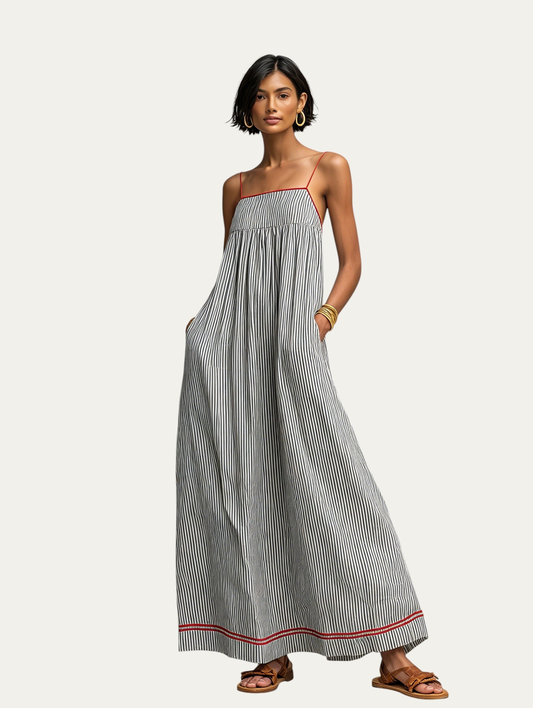 Vestido largo de tirantes finos a rayas gris oscuro, con bies roja y blanca en el bajo