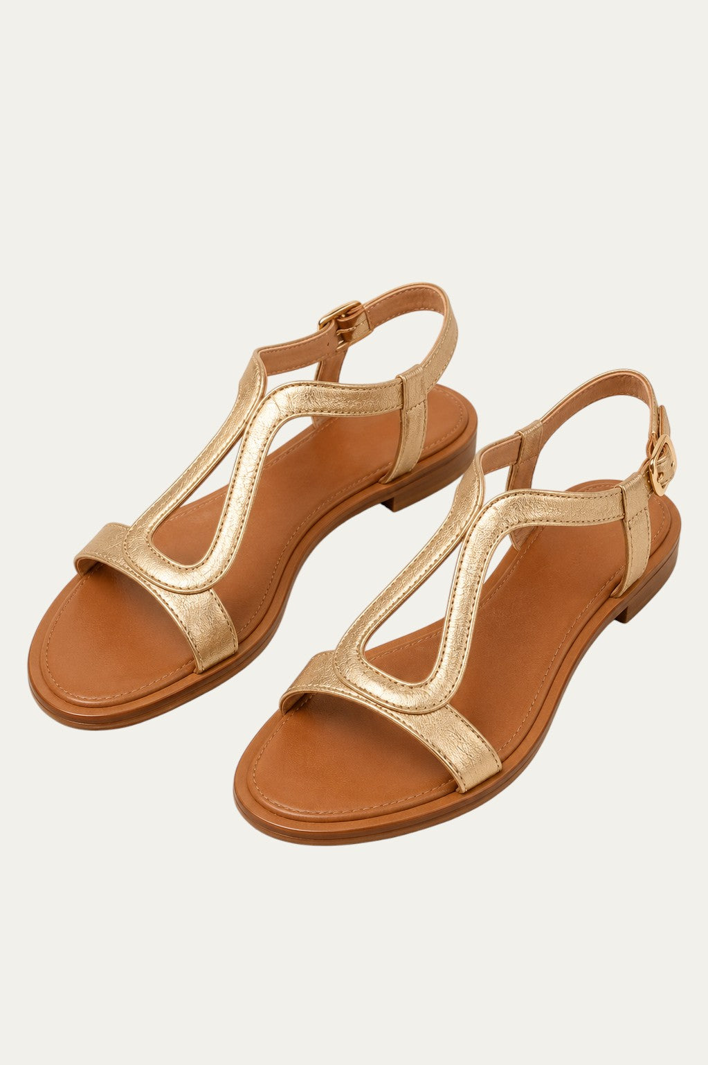 Sandalias planas metalizadas color dorado con tira frontal en forma de T