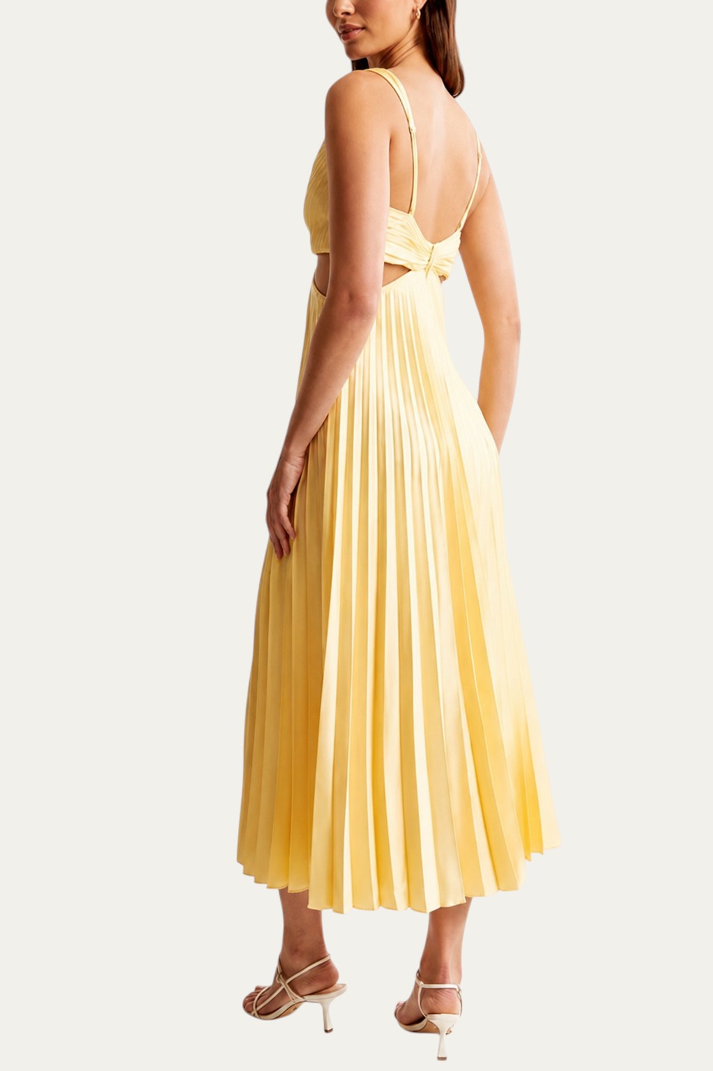 Vestido largo elegante amarillo con escote en V, tirantes finos y falda plisada