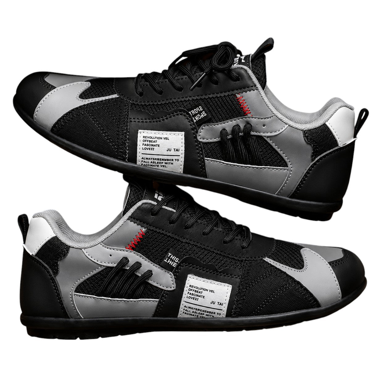 Zapatillas retro negras con paneles grises y blancos, cordones negros y detalle rojo.