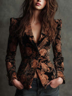 Blazer entallado negro con estampado floral en tonos bronce, solapa y botones
