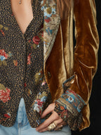 Blazer vintage marrón con mangas aterciopeladas y bajo con panel floral