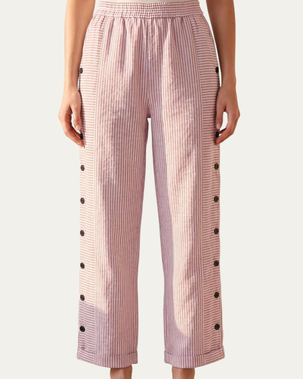 Pantalón mujer a rayas rosa claro con cintura elástica y botones en el lateral