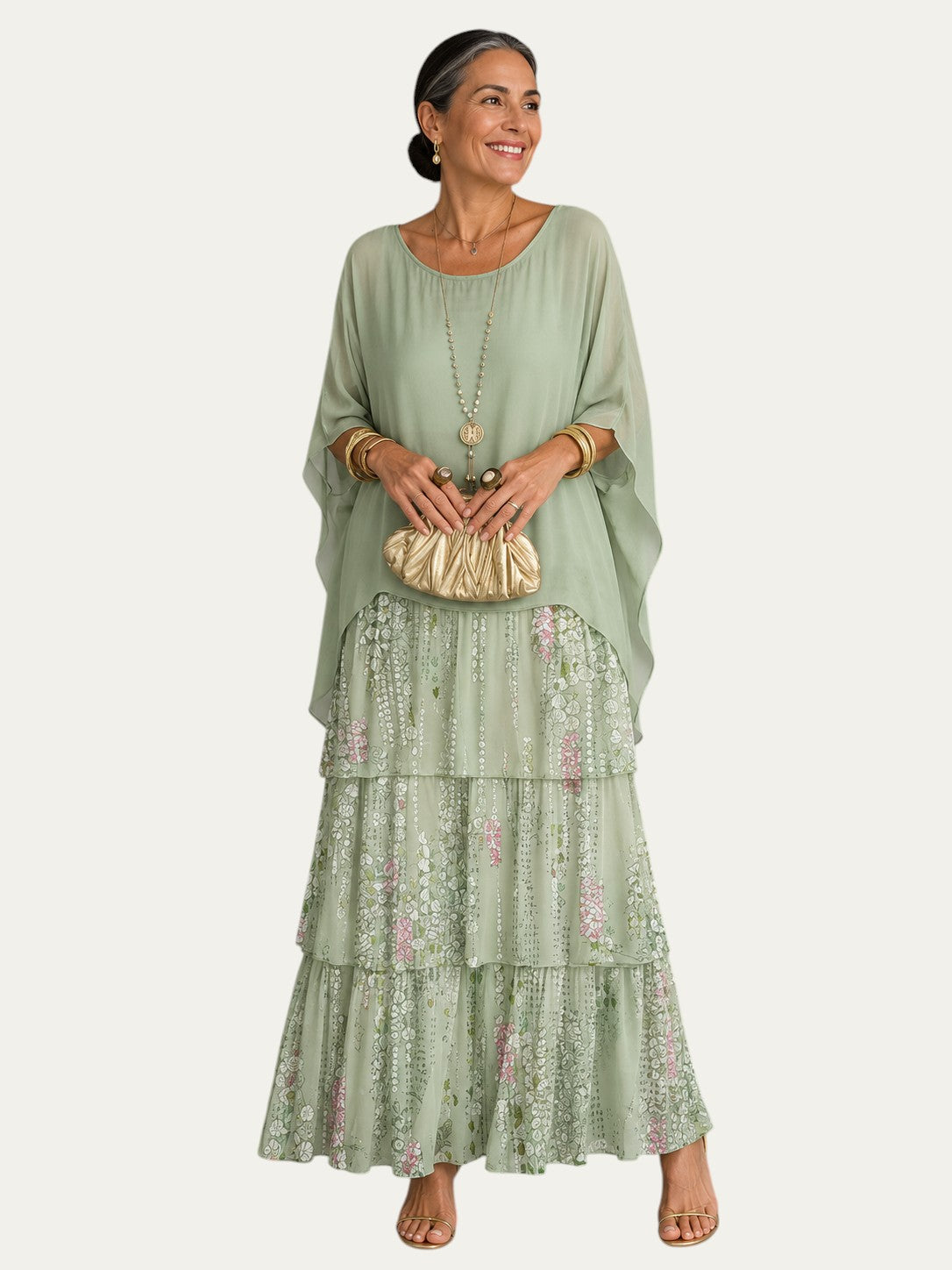 Vestido largo elegante verde con falda estampada floral y mangas tipo capa