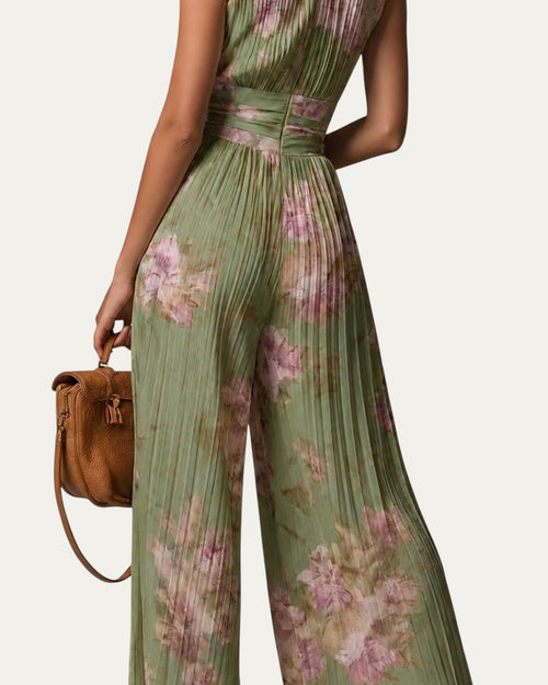 Mono sin mangas de gasa plisada verde con escote V y estampado floral rosa, pierna amplia.