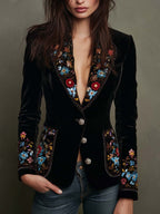 Blazer negro de Giulia con bordado floral multicolor y solapa con ribete dorado