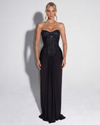 Vestido maxi negro con corsé sin tirantes cubierto de lentejuelas y falda larga