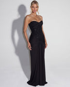 Vestido maxi negro con corsé sin tirantes de lentejuelas y falda larga con nudo