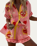 Conjunto de verano rosa con botones y estampado floral, manga corta y falda corta