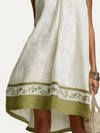 Vestido mini blanco sin mangas con cenefa floral verde oliva en el bajo