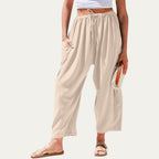 Pantalones fluidos beige claro, cintura elástica con cordón, pierna amplia y suelta