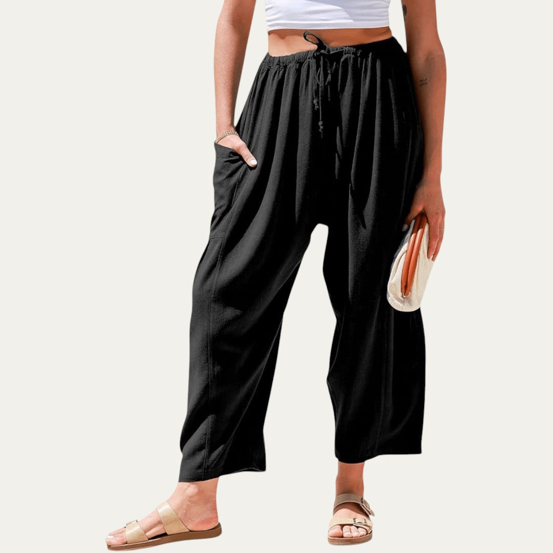 Pantalones fluidos negros, cintura elástica con cordón, tiro alto, pierna amplia