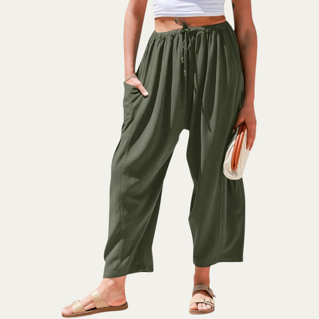 Pantalones fluidos verde oscuro, cintura elástica con cordón, pliegues, tiro alto