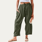 Pantalones fluidos verde oscuro, cintura elástica con cordón, pliegues, tiro alto