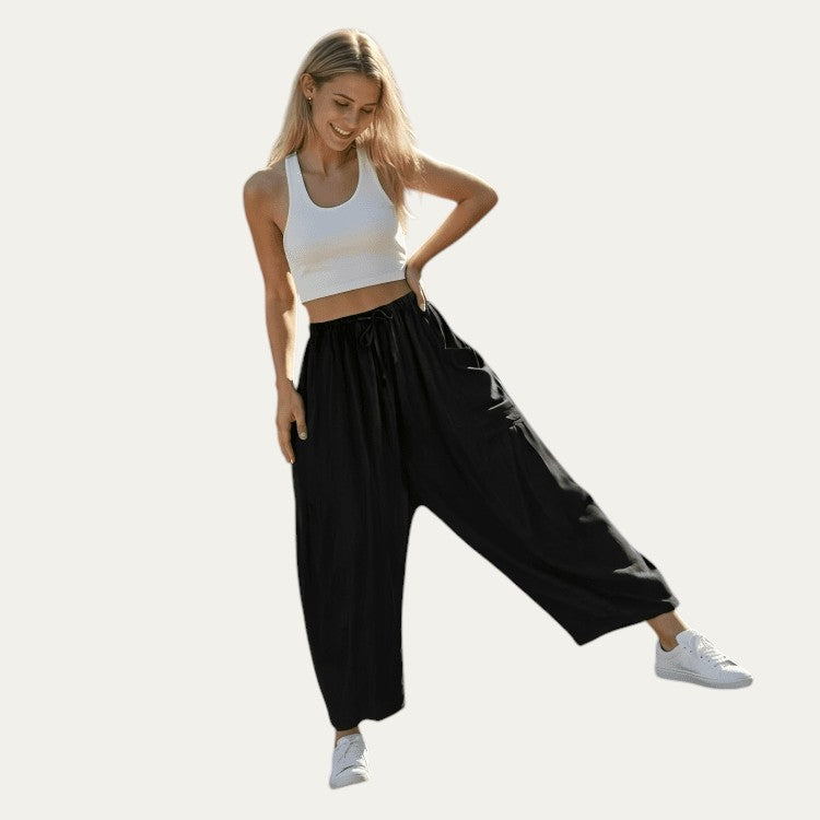 Pantalones fluidos negros de pernera ancha con cintura elástica